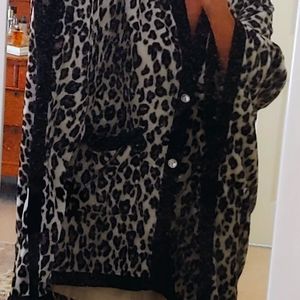 Concierge brand black, white & taupe animal print cape. Washable polyester. MINT